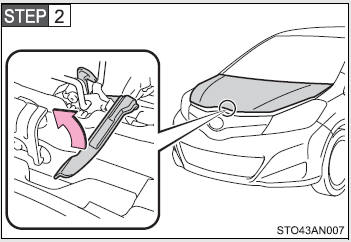 Pull up the auxiliary catch lever and lift the hood.