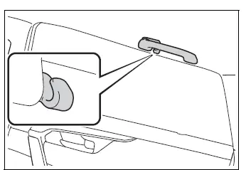 Coat hook integrated into a rear assist grip