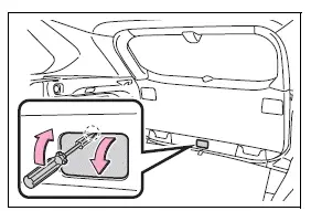 Removing the interior back door access cover with a protected screwdriver