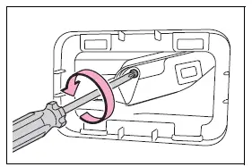 Loosening the back door emergency release cover screw