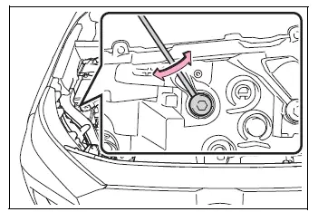 Phillips-head screwdriver turning headlight adjustment bolt A