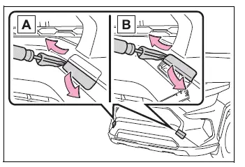 Removing Type A towing eyelet covers with a flathead screwdriver