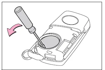 CR2032 battery installed with the positive terminal facing upward