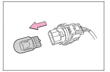 Front turn signal and parking light bulb removed from its socket