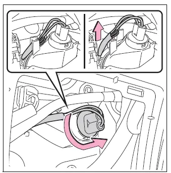 Back-up light cord released from clip before bulb base removal