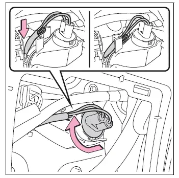 Back-up light bulb base secured and electrical cord returned to clip