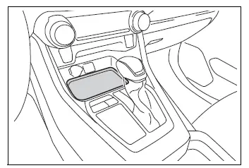 Open storage tray at the front of the center console