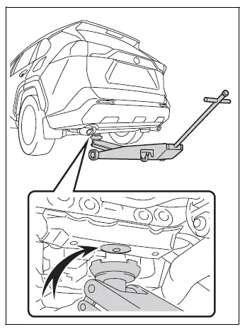 Rear floor jack point beneath the vehicle