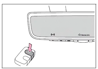 HomeLink button and remote transmitter used during device programming