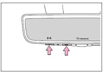 Two outside HomeLink buttons held to erase all stored codes