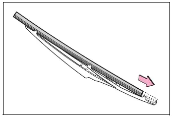 Replacement rear wiper insert being guided through the blade retaining claws