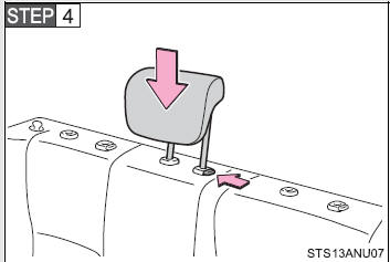 Lower the center head restraint to the lowest position.