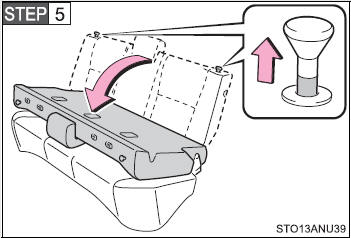 Pull both seatback lock release knobs at the same time and fold the seatback