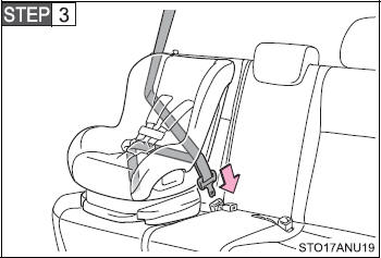 Run the seat belt through the child restraint system and insert the plate into