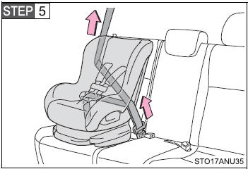 While pushing the child restraint system into the rear seat, allow the shoulder