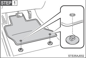 Insert the retaining hooks (clips) into the floor mat eyelets.