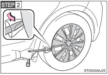 To protect the wheel ornament, place a rag between the wrench and the wheel ornament.