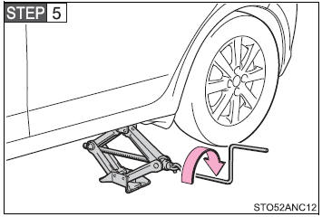 Raise the vehicle until the tire is slightly raised off the ground.