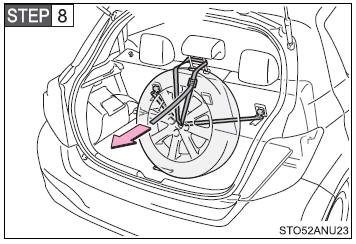 Hold the buckle and pull the belt to secure the tire.