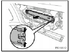 2. Pinch the knobs located on each side and remove the filter cover.