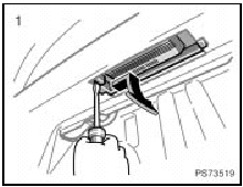 Use a flathead screwdriver.