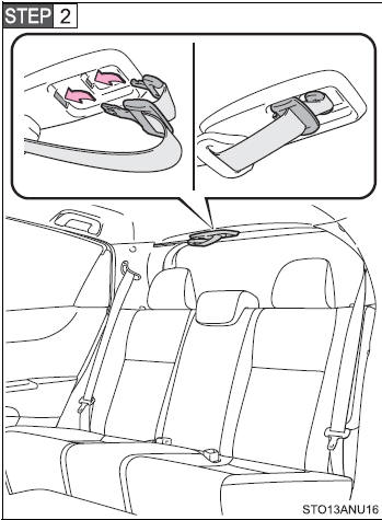 Stow the seat belt tabs in the cover set in the roof as shown.