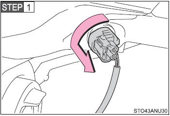 Turn the bulb base counterclockwise.