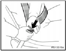 To release the belt, press the buckle release button and allow the belt to